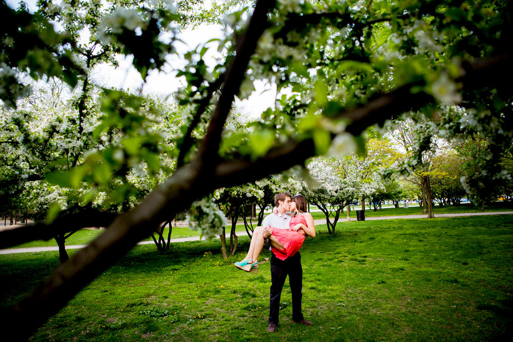 Couple kisses under a tree in Olive Park